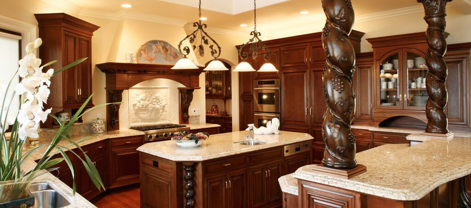 Luxury kitchen with dark wood cabinetry and brass lighting